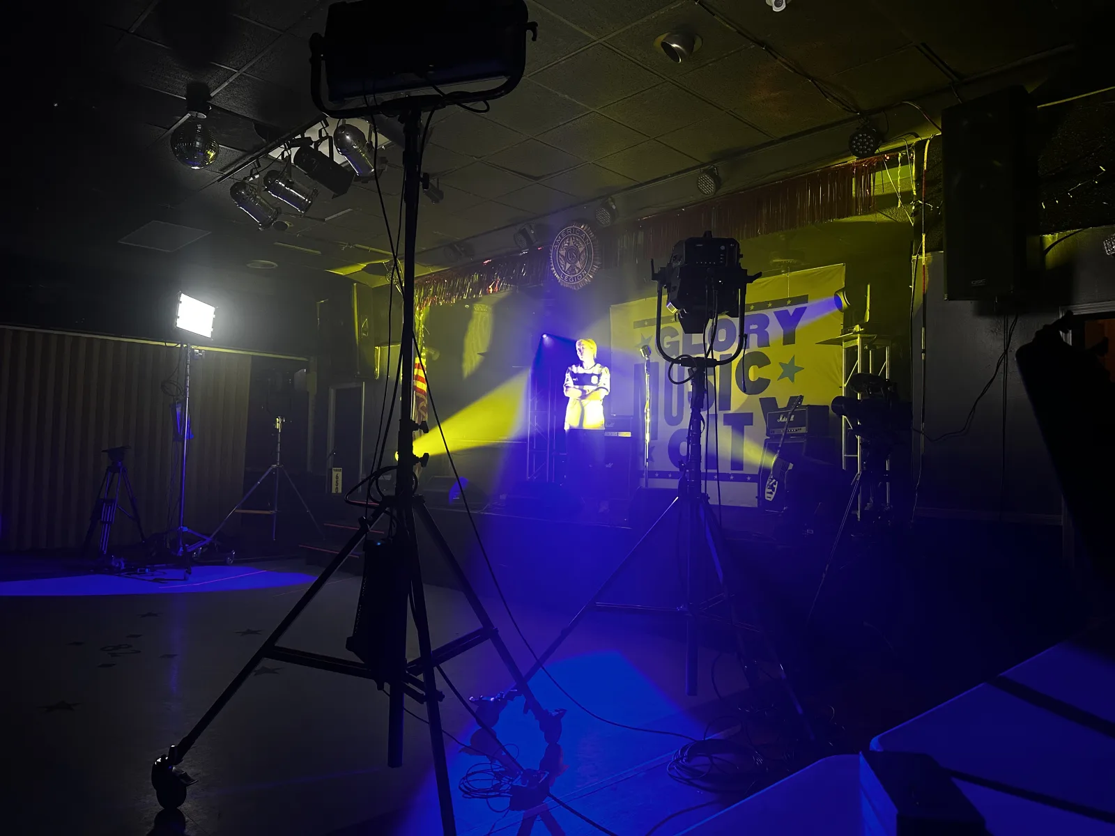 Nashville Soccer Club player lit with navy and gold beams through haze during the team's annual photo shoot — ARRI and High End fixtures on stands by Nashville Audio Visual