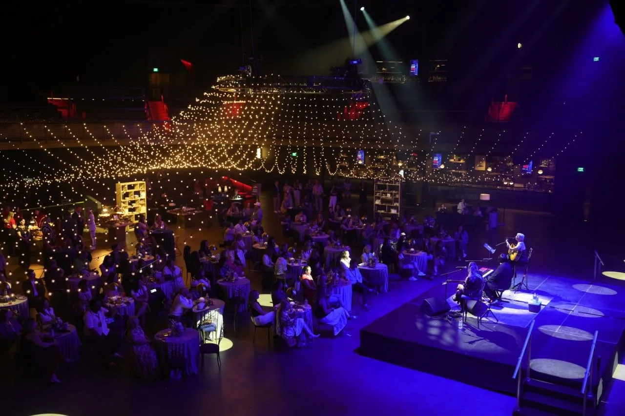 Blue-lit stage under a string-light canopy at a Nashville event produced by Nashville Audio Visual