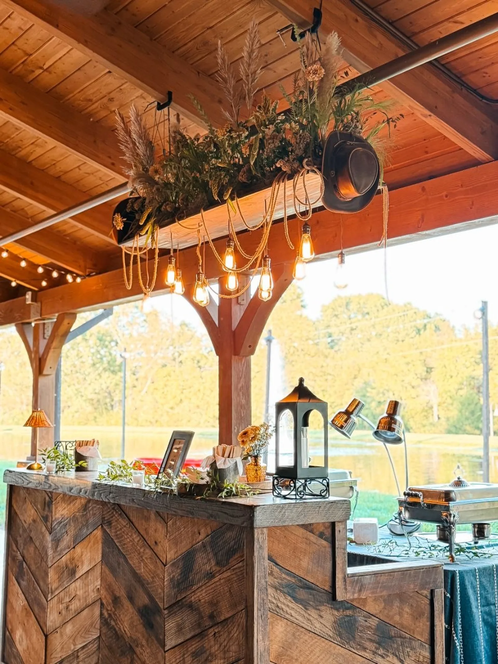 Custom herringbone reclaimed-wood buffet station built by Nashville Audio Visual for the Dye Collective launch